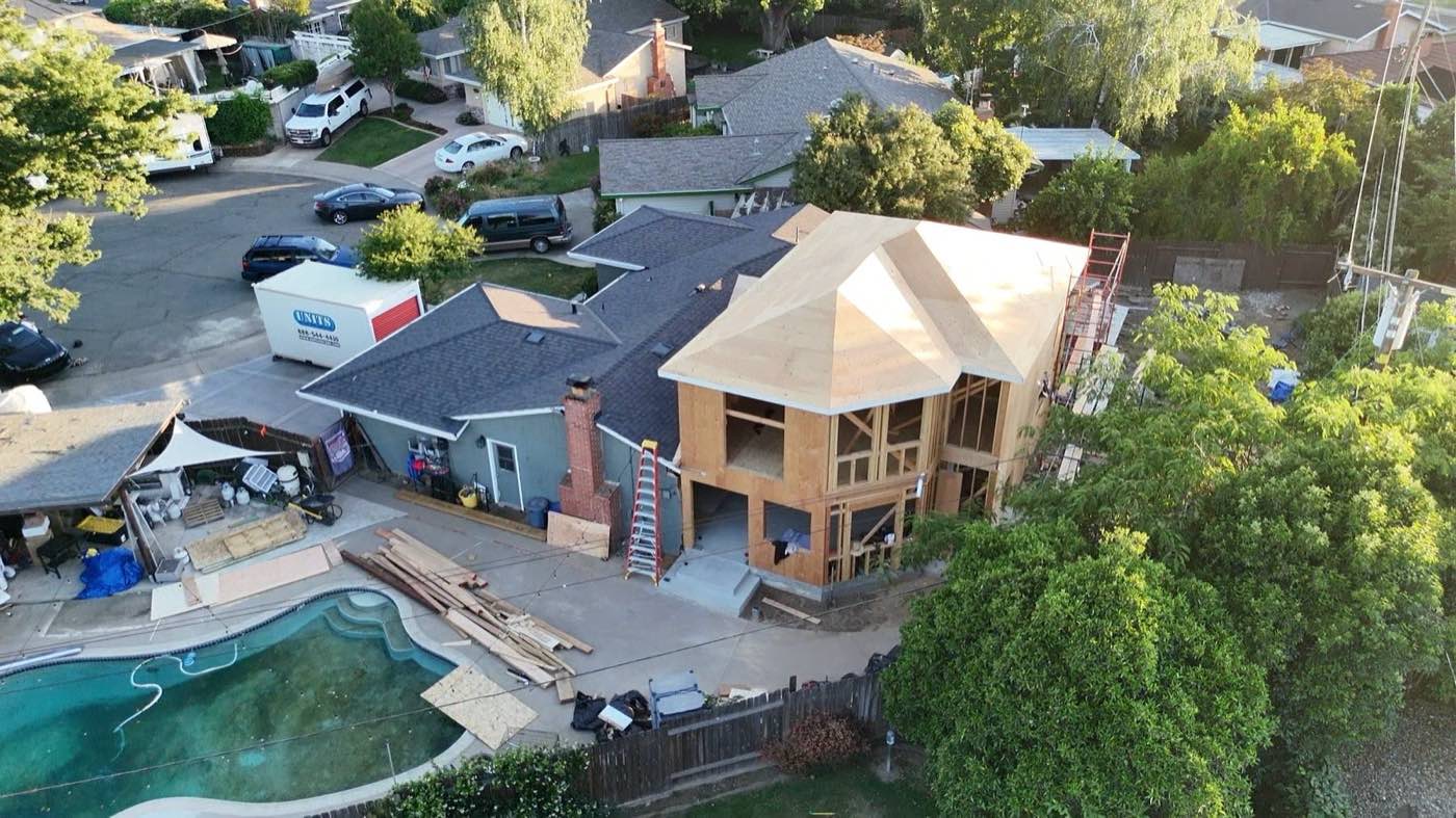 Aerial view of a second-story addition framed over an existing home