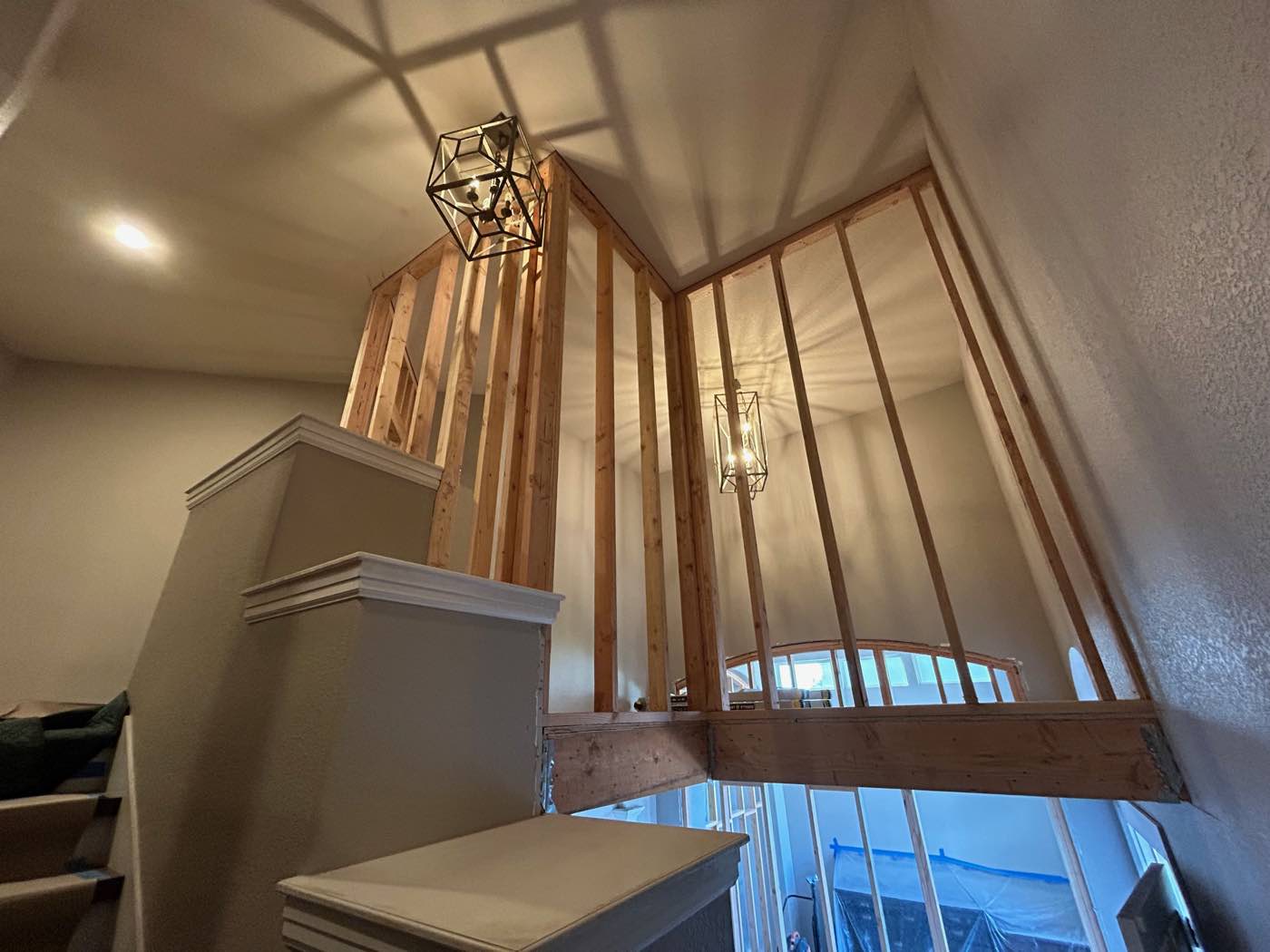 Interior remodel opening up a vaulted ceiling with new framing