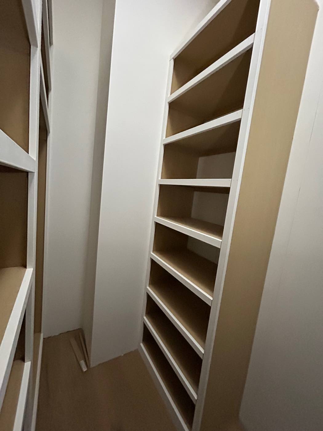 Tall custom pantry shelving built floor to ceiling