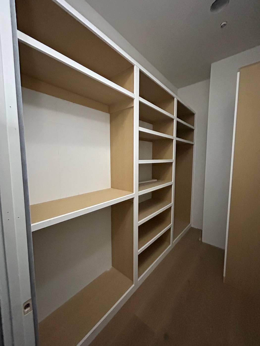 Custom closet built-ins with shelves and hanging space